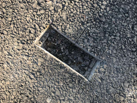 Place of sampling the asphalt coating in the form of a rectangular from asphalt concrete pavement. Kern. Close-upの写真素材