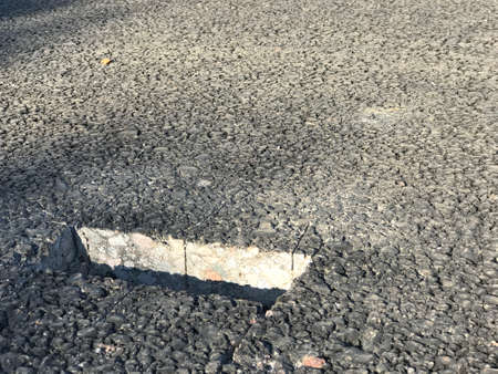 Place of sampling the asphalt coating in the form of a rectangular from asphalt concrete pavement. Kern. Close-upの写真素材