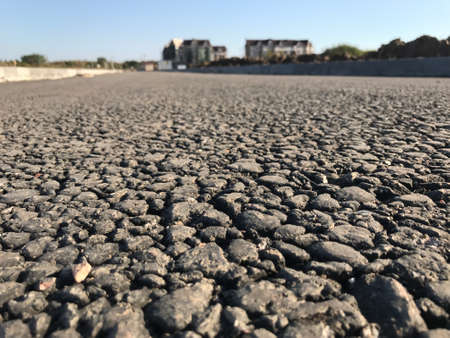 Rough asphalt pavement in the summer season. Close-upの写真素材