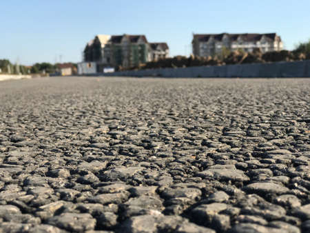 Rough asphalt pavement in the summer season. Close-upの写真素材