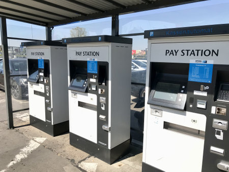 BERLIN, GERMANY - APRIL 20, 2018: Three pay stations, resembling gas pumps, are strategically placed...