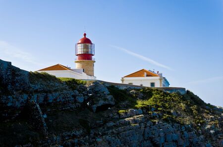 Lighthouse of Cabo de São Vicente, on top of a rock against the blue sky.の写真素材