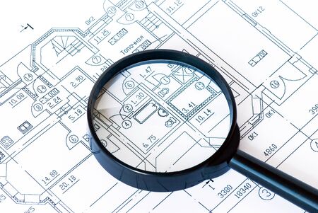 Magnifying glass in the drawing at home close-up