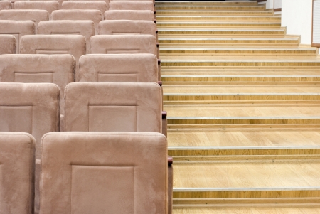 rows of velvet seats in the auditoriumの写真素材