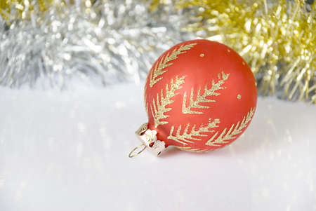 Christmas ball on a background tinselの写真素材
