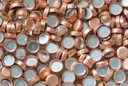 background of scattered copper hunting primers