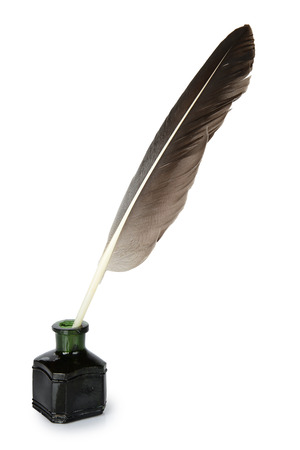 quill in the inkwell on a white backgroundの写真素材