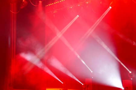Illuminated empty concert stage with smoke