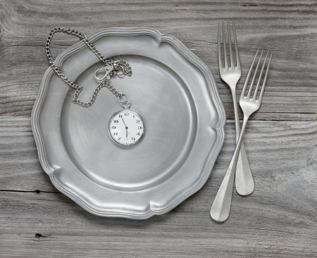 Two vintage fork on a pewter plateの写真素材