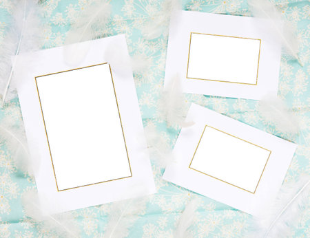 Scrapbook page with frames and fuzzies on a background of blue fabricの写真素材