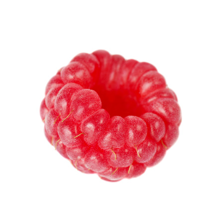 One ripe red raspberry isolated on a white background