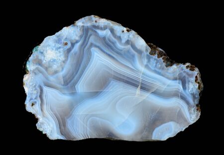 Slice of blue agate geodes with concentric layers, isolated on a black background