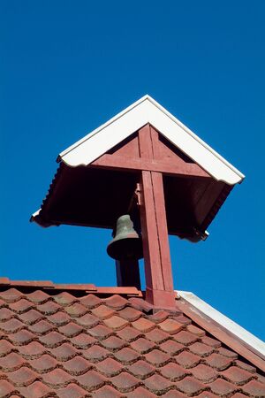 Bell tower on traditional, old, red buildingの写真素材