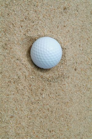 Golf-ball caught in bunkerの写真素材