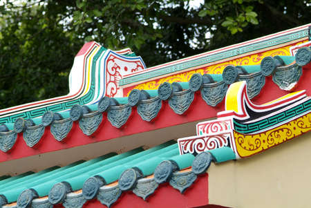 Roof detail of colourful Chinese temple in Thailand