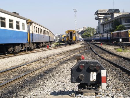 Old fashioned railway signal and trains at Hua Lampong railway station in Bangkok, Thailandの写真素材