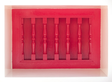 Recessed window covered by a red, wooden blind, isolated on whiteの写真素材