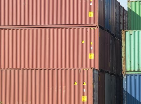 Stack of 40 foot freight containers, side view.