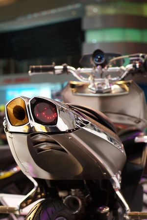 Rear detail of futuristic motorbike. Shallow depth of field.