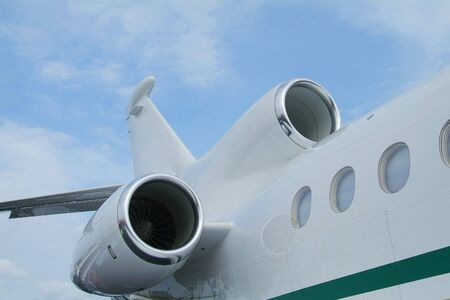 Rear detail of three engined business jet aircraft