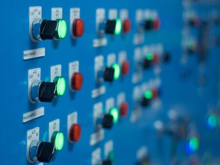 Electric switch panel with red and green light. Very shallow depth of field.の写真素材