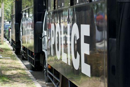 Police trucks parked at the roadside during the red protests in Bangkok, Thailand April 2009....