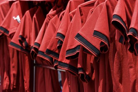 Red shirts for sale on the street in Bangkok, Thailand, during the political demonstrations in April 2009. Shallow depth of field.の写真素材