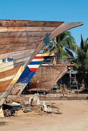 Wooden ships being repaired at a shipyard in Naklua, Chonburi province, Thailandの写真素材