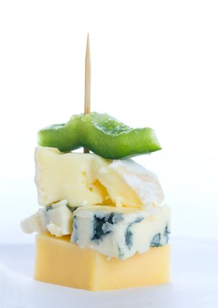 Cheese snack with three kinds of cheese and a piece of capsicumの写真素材