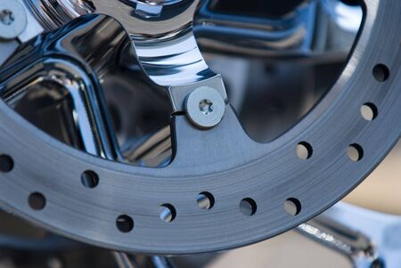 Detail of motorbike disk brake. Shallow depth of field with the nearest parts in focus.の写真素材