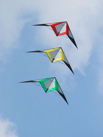 Stack of three stunt kites in the colours red, yellow and green.の写真素材