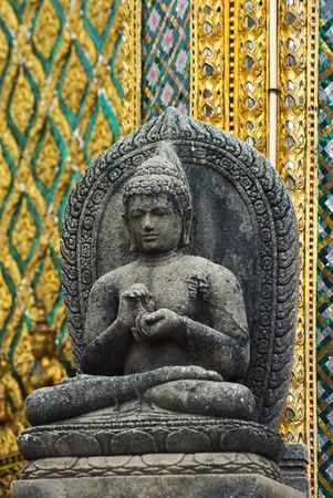 Ancient Buddha image made from stone at Wat Phra Kaeo in Bangkok, Thailand.の写真素材