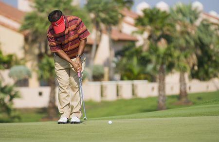 BANGKOK, THAILAND - JANUARY 10: Thai golf player Prayad Marksaeng putting at the Royal Trophy tournament, Asia vs Europe, at Amata Spring, Bangkok, Thailand on January 10, 2010.のeditorial素材