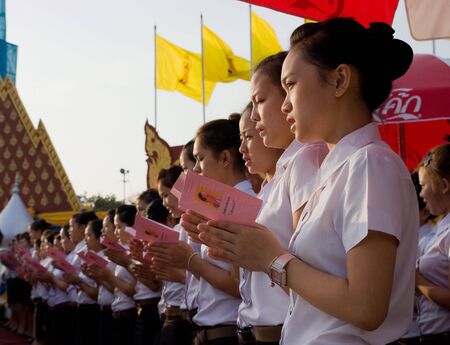 BANGKOK, THAILAND - DECEMBER 5: The celebration of the 82nd birthday of H.M. King Bhumipol Adulyadej in Bangkok, Thailand on December 5 2009. Student choir singing at Sanam Luang in Bangkok during sunrise.のeditorial素材