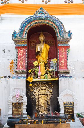 Standing Buddha image in a stupa at Wat Ket in Chiang Mai, Thailand.の写真素材