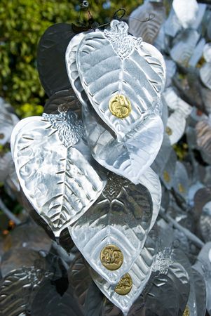 Detail of tree with silver leaves at Wat Lok Malee, a Lanna style Buddhist temple in Chiang Mai, Thailand.の写真素材
