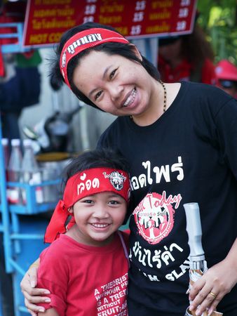 BANGKOK, THAILAND - APRIL 21: Members of the Red Shirts political movement who try to force prime minister Abhisit Vejjajiva to resign by staging huge demonstrations in Bangkok, Thailand April 21, 2010.のeditorial素材