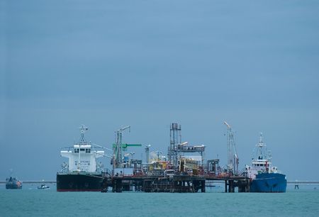 Two small oil tankers at an offshore oil terminal in the Gulf of Siam.の写真素材