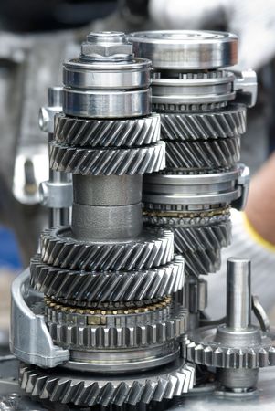 Assembly of a car gearbox. Shallow depth of field with the first group of gears in focus.の写真素材