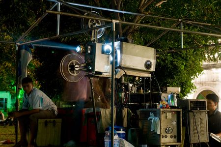 SAMUT PRAKAN - NOVEMBER 7: Outdoor movie theater at the temple during the Pra Samut Chedi temple fair on November 7, 2010 in Samut Prakan, Thailand.のeditorial素材