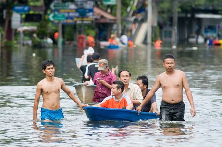 BANGKOK, THAILAND - OCTOBER 29: People navigating the streets during the worst flooding in decades in Bangkok, Thailand on October 29, 2011.のeditorial素材