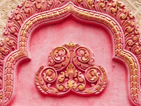 Pink and gold ornament at Buddhist temple in Odomak, Cambodiaの写真素材