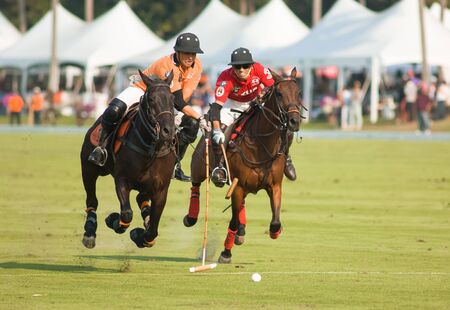 PATTAYA - JANUARYÂ 19: Players fighting for the ball during the final between Thai Polo and Axus Polo at Thai Polo Open on JanuaryÂ 19, 2013 in Pattaya, Thailand.のeditorial素材