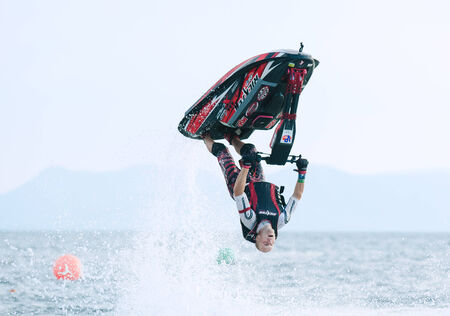 PATTAYA - DECEMBER 7: Alexyy Krivosheia from Russia competing during the freestyle competition of Thai Airway International Jet Ski World Cup at Jomtien Beach, Pattaya, Thailand on December 7, 2014.のeditorial素材