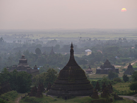 Hazy sunset over Mrauk U in the northern part of the Rakhin State, Myanmarの写真素材