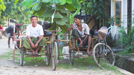 Sittwe Rakhin State Myanmar  October 15 2014: Two bicycle taxis waiting for passengers in Sittwe the capital of the Rakhine State in Myanmar.のeditorial素材