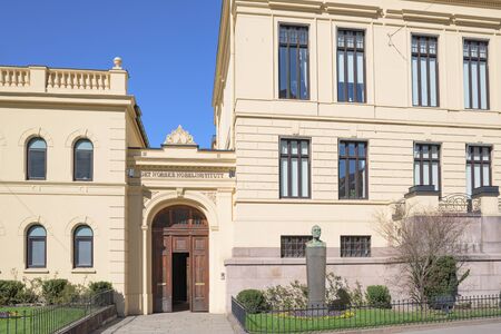 Entrance of The Norwegian Nobel Institute in Oslo with a bust of Alfred Nobel in the foreground.のeditorial素材