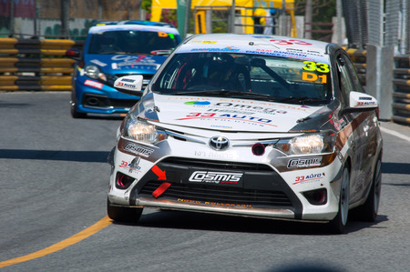 Bang Saen, Thailand - November 27, 2015: A Toyota Vios leading a slower Honda Brio at the 6 hour race street race during Bang Saen Speed Festival at Bang Saen, Chonburi, Thailand.のeditorial素材