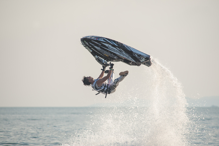 Pattaya, Thailand - December 6, 2015: Taiji Yamamoto from Japan during his performance at the freestyle competition during the International Jet Ski World Cup at Jomtien Beach, Pattaya, Thailand.のeditorial素材