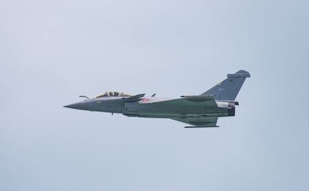 Singapore - February 14, 2016: Dassault Rafale from The French Air Force Arme de l'air during its performance at Singapore Airshow at Changi Exhibition Centre in Singapore.のeditorial素材
